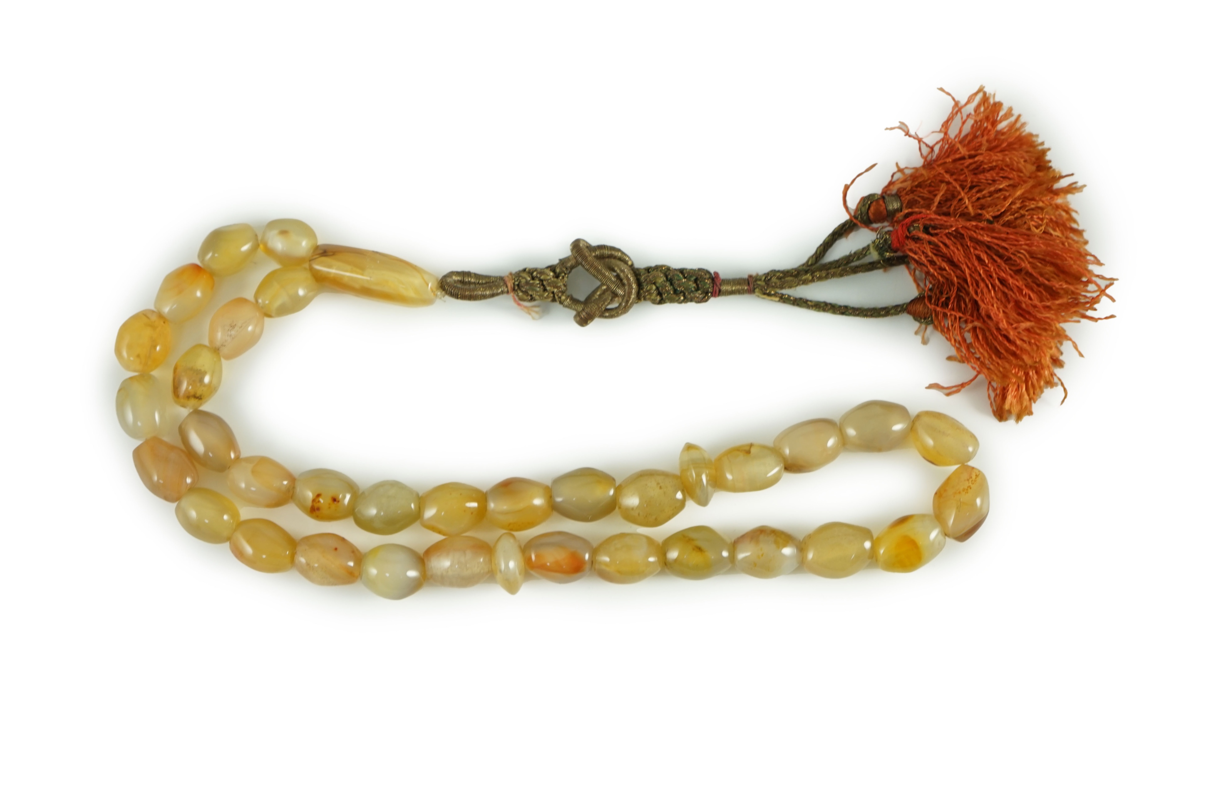 A Sino-Tibetan row of agate prayer beads, 19th century Total drop including tassel 36 cm